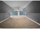 Large bonus room with gray walls, neutral carpeting and a ceiling fan at 3116 Kirby St, Durham, NC 27713
