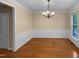 Traditional dining room featuring hardwood floors, a chandelier, and classic wainscoting for an elegant touch at 3116 Kirby St, Durham, NC 27713