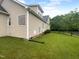 Exterior home with grassy lawn and trees at 3116 Kirby St, Durham, NC 27713