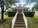 Charming brick home featuring a welcoming front porch and well-maintained landscaping at 3116 Kirby St, Durham, NC 27713