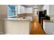 Bright kitchen with white cabinets, granite countertops, and stainless steel appliances at 3116 Kirby St, Durham, NC 27713