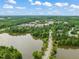Aerial shot of a neighborhood community and its surrounding scenery with a lake at 324 Waterford Lake Dr, Cary, NC 27519
