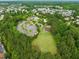Aerial shot of neighborhood community, featuring amenities like a pool and playground at 324 Waterford Lake Dr, Cary, NC 27519