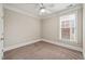 Cozy bedroom with a neutral color scheme, large window and standard-sized closet at 324 Waterford Lake Dr, Cary, NC 27519