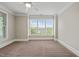 Serene bedroom boasts large windows offering an abundance of natural light and pleasant views at 324 Waterford Lake Dr, Cary, NC 27519
