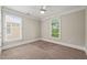Inviting bedroom with a ceiling fan, large window and neutral decor at 324 Waterford Lake Dr, Cary, NC 27519