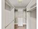 Walk-in closet with custom shelving, drawers and plenty of hanging space at 324 Waterford Lake Dr, Cary, NC 27519