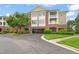 View of the apartment complex featuring parking, balconies, and lush landscaping on a sunny day at 324 Waterford Lake Dr, Cary, NC 27519