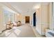 Well-lit hallway featuring carpet flooring, decorative trim, an elevator, and ample space at 324 Waterford Lake Dr, Cary, NC 27519
