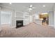 Spacious living room features fireplace, built-in shelving and an open floor plan to kitchen with breakfast bar at 324 Waterford Lake Dr, Cary, NC 27519