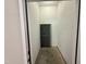 A secure storage unit with white brick walls and a screened entrance provides added space and security at 324 Waterford Lake Dr, Cary, NC 27519