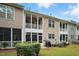 Exterior shows townhome backyard with a screened-in porch, grill and patio space for outdoor enjoyment at 369 Roberts Ridge Dr, Cary, NC 27513