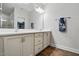 Bright bathroom featuring a double vanity with a white countertop and sleek fixtures at 369 Roberts Ridge Dr, Cary, NC 27513