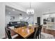 Open-concept dining room with hardwood floors and a view of the living room at 369 Roberts Ridge Dr, Cary, NC 27513