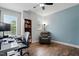 Spacious office with hardwood floors, an accent wall, and comfortable furniture for work and relaxation at 369 Roberts Ridge Dr, Cary, NC 27513