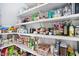 Organized walk-in pantry with white shelving and ample storage space for groceries at 369 Roberts Ridge Dr, Cary, NC 27513