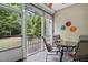 Cozy screened-in porch features comfortable seating, a table, and views of the outdoors at 369 Roberts Ridge Dr, Cary, NC 27513