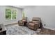 Relaxing recreation room with natural light, comfortable seating, and a view of the outdoors at 369 Roberts Ridge Dr, Cary, NC 27513