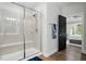 Modern bathroom with a glass-enclosed shower and tiled walls, offering a clean and stylish space at 369 Roberts Ridge Dr, Cary, NC 27513