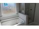 Bathroom featuring a soaking tub and separate shower with tile surround at 39 Braddock Ct, Garner, NC 27529