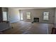 Spacious living room featuring a fireplace and ample natural light from windows at 39 Braddock Ct, Garner, NC 27529