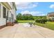 Backyard patio with seating, landscaping, and a view of the lawn at 40 Breckenridge Pl, Dunn, NC 28334