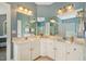 Dual sink bathroom offers ample counter space, bright lighting, and a clear view into the shower and tub area at 40 Breckenridge Pl, Dunn, NC 28334