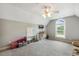 Large bedroom featuring a vaulted ceiling, ceiling fan, and many decorative items at 40 Breckenridge Pl, Dunn, NC 28334