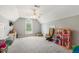 Spacious bedroom featuring a vaulted ceiling, ceiling fan, and large window at 40 Breckenridge Pl, Dunn, NC 28334