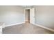 Empty bedroom featuring neutral tones and a door leading to another room at 40 Breckenridge Pl, Dunn, NC 28334