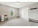 Bright bedroom with neutral tones, featuring a desk, bench, and a large window, creating a serene retreat at 40 Breckenridge Pl, Dunn, NC 28334