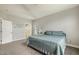 Cozy bedroom with plush carpet, neutral walls, and modern decor accents, including a stylish black metal bed frame at 40 Breckenridge Pl, Dunn, NC 28334