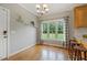 Dining area with hardwood floors, large windows, and modern lighting fixtures at 40 Breckenridge Pl, Dunn, NC 28334
