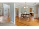 Light-filled dining room features hardwood floors and stylish chandelier at 40 Breckenridge Pl, Dunn, NC 28334