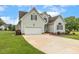 Inviting home boasts an attached garage, long driveway, and pleasant landscaping at 40 Breckenridge Pl, Dunn, NC 28334