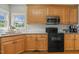 Kitchen with light wood cabinets, granite counters, subway tile backsplash and stainless steel appliances at 40 Breckenridge Pl, Dunn, NC 28334