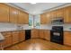 Beautiful kitchen featuring custom cabinetry, granite countertops, and black appliances at 40 Breckenridge Pl, Dunn, NC 28334