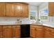 Kitchen with light wood cabinets, granite countertops, subway tile and black appliances at 40 Breckenridge Pl, Dunn, NC 28334