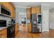 Well-equipped kitchen with modern appliances, granite countertops, and wood cabinetry at 40 Breckenridge Pl, Dunn, NC 28334
