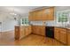 Spacious kitchen with light wood cabinets, granite countertops, and hardwood floors at 40 Breckenridge Pl, Dunn, NC 28334
