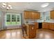 Eat-in kitchen with granite island, hardwood floors, and ample natural light at 40 Breckenridge Pl, Dunn, NC 28334