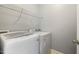 Functional laundry area with modern washer and dryer, and ample storage space to help make laundry days easy at 40 Breckenridge Pl, Dunn, NC 28334