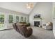 Living room with vaulted ceilings, fireplace, and natural light at 40 Breckenridge Pl, Dunn, NC 28334