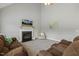 Cozy living room features a fireplace, vaulted ceiling, and comfortable seating at 40 Breckenridge Pl, Dunn, NC 28334