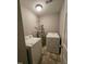 The functional laundry area with a washer, dryer, and essential utility connections at 401 Coalinga Ln # 106, Raleigh, NC 27610