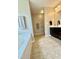 Relaxing bathroom with a built-in soaking tub and a dark wood vanity at 411 Joneshaven Dr, Fuquay Varina, NC 27526