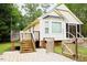 Backyard with wooden deck and stairs leading to a fenced-in area at 419 Jera Dr, Garner, NC 27529
