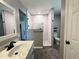 Modern bathroom with tiled walk-in shower, marble countertop, and black fixtures at 419 Jera Dr, Garner, NC 27529