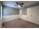 Comfortable bedroom with ceiling fan, carpet, and neutral wainscoting at 419 Jera Dr, Garner, NC 27529