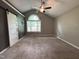Large bedroom with a vaulted ceiling, a ceiling fan, and a large window at 419 Jera Dr, Garner, NC 27529